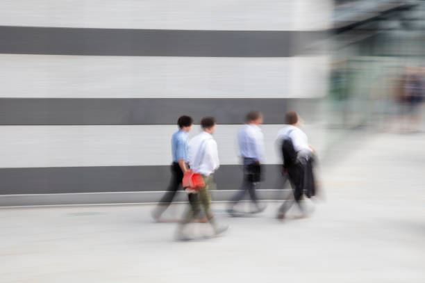 istock Four Business People Walking to Work in Financial District 1092303734