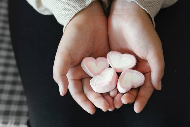 istock Asian young girl with heart candy in hands. 1092303876