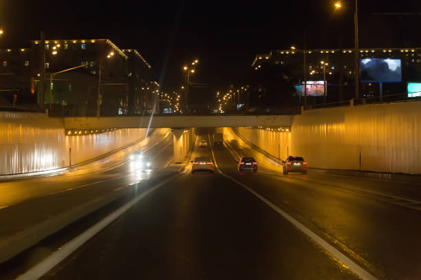 istock Cars drive through the viaduct at night. 1092305918