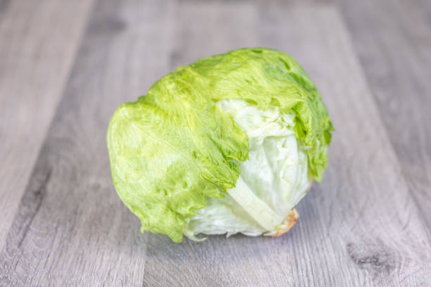 istock Iceberg lettuce on a wooden table 1092311574