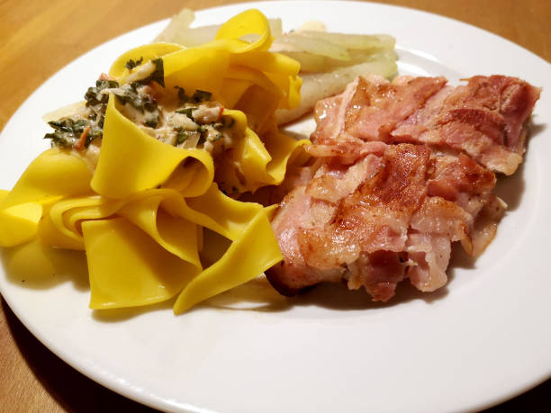 istock pike fish with noodle, bacon and turnip cabbage 1092312996