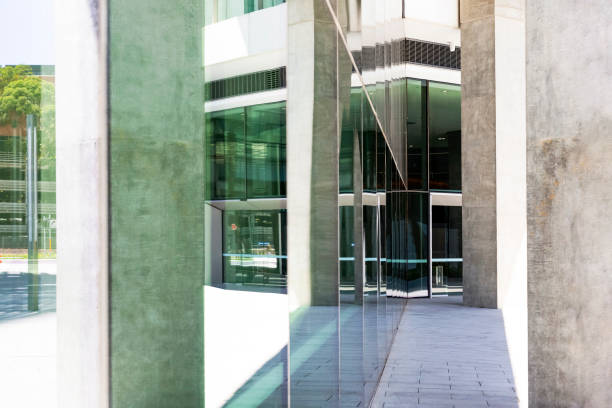 istock Entry of modern glass office building with reflection, copy space 1092313434