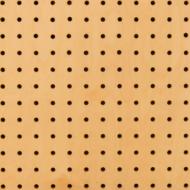 istock Close up of brown yellow wall surface holed grid texture. dot pattern 1092315674