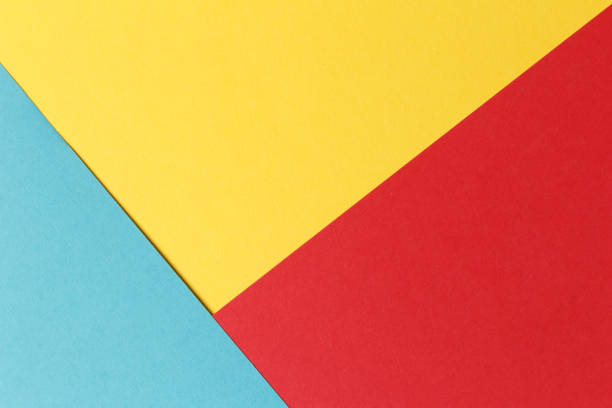 istock Abstract geometric festive background: red, yellow, blue. Paper background top view, minimalistic concept. 1092319262