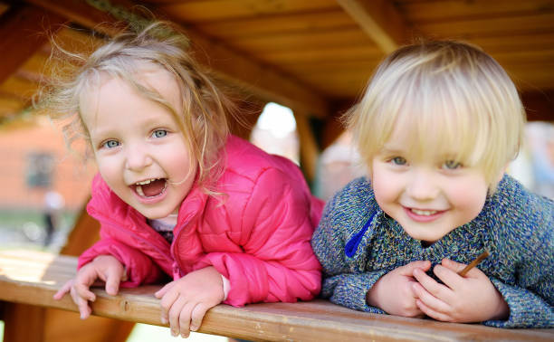 istock Happy kids having fun on outdoor playground 1092326140