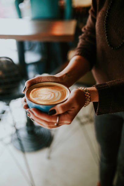 istock coffee latte art cup on girl's hand 1092326842