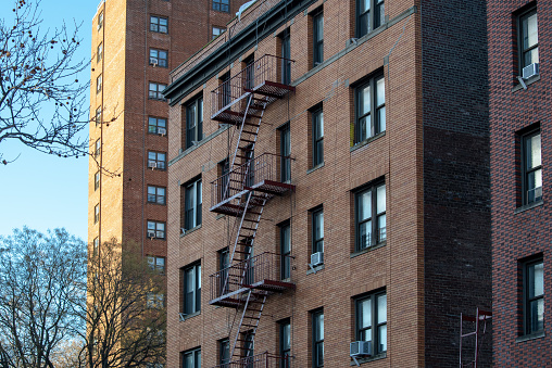 New-York building facades with fire escape stairs angle view