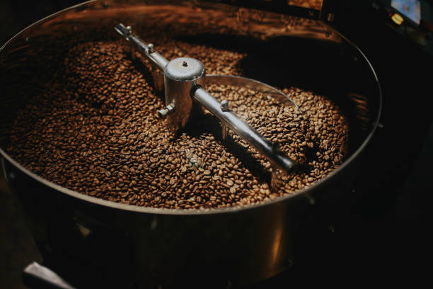 istock Freshly roasted aromatic coffee beans in a modern coffee roasting machine. 1092334770