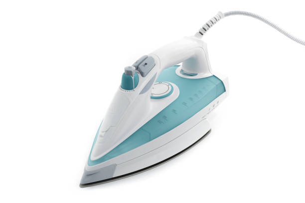 istock Steam iron laid on white background, elegant pastel turquoise model 1092336636