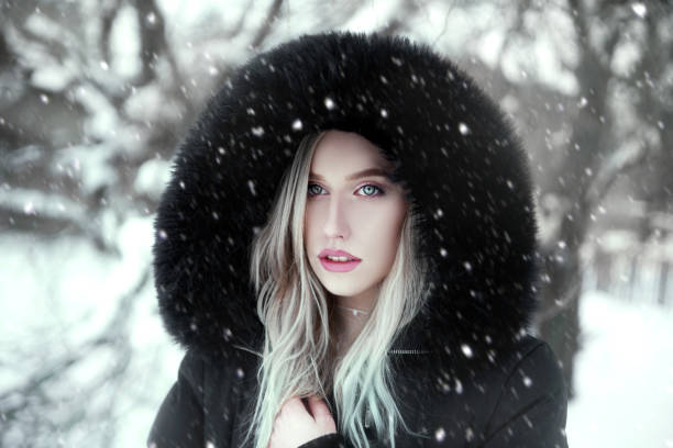 istock Woman wearing black jacket with hood 1092336710