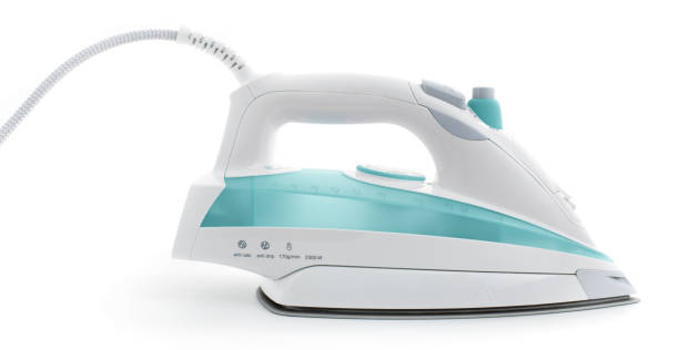 istock Steam iron laid on white background, elegant pastel turquoise model 1092337758