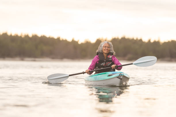 istock Senior woman kayaking on an Oregon river 1092342480