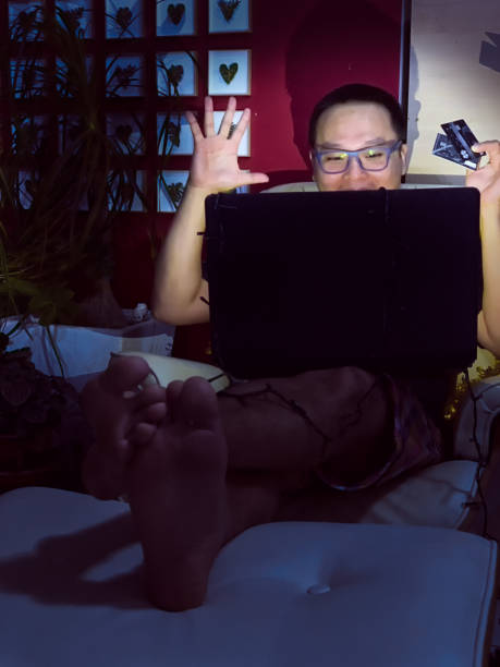 istock Asian man shopping online at Christmas. 1092345466