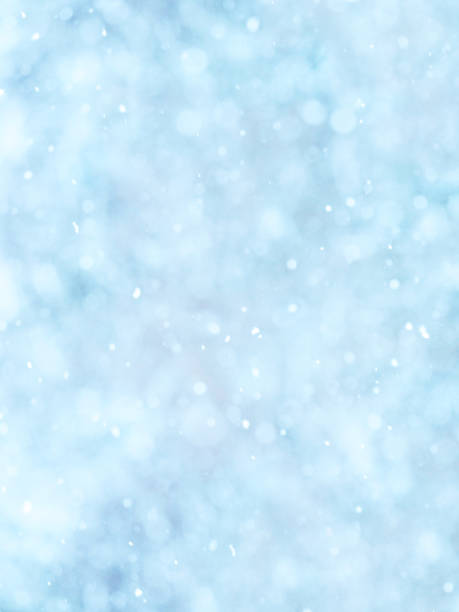 istock Snowing. Vertical abstract soft natural winter background,  falling snowflakes. Light blue tone 1092349582