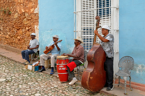 Havana / Cuba - April 2015: Music and music albums in Havana and almost all cities, music groups on the streets. Tourists are happy and have fun with dancing.