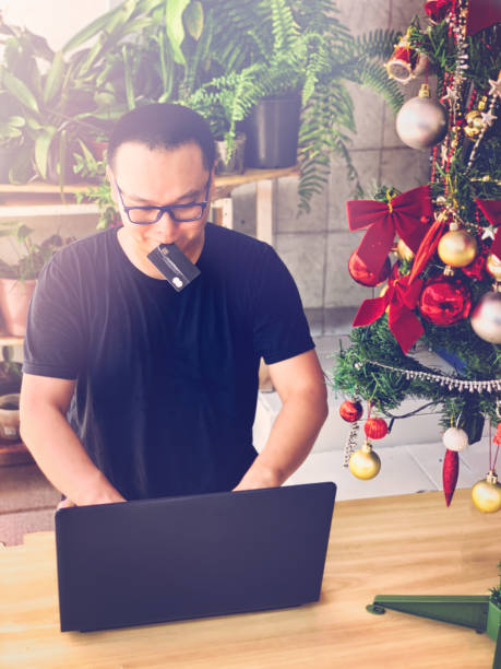 istock Asian man shopping online at Christmas. 1092355808
