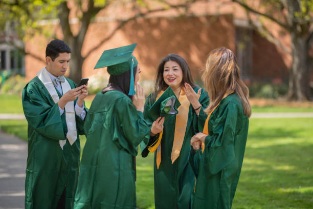 istock A multiethnic group of graduating students celebrate on the campus lawn 1092357132