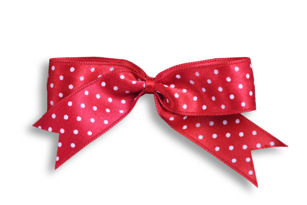 Red bow with white polka dots isolated on white background