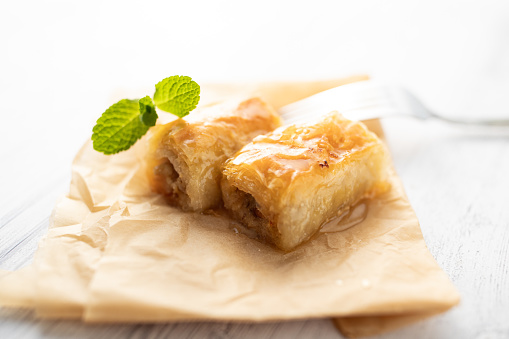 Baklava dessert slices on white background