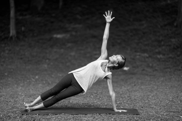 istock Young Woman Stretching At Park 1092374738