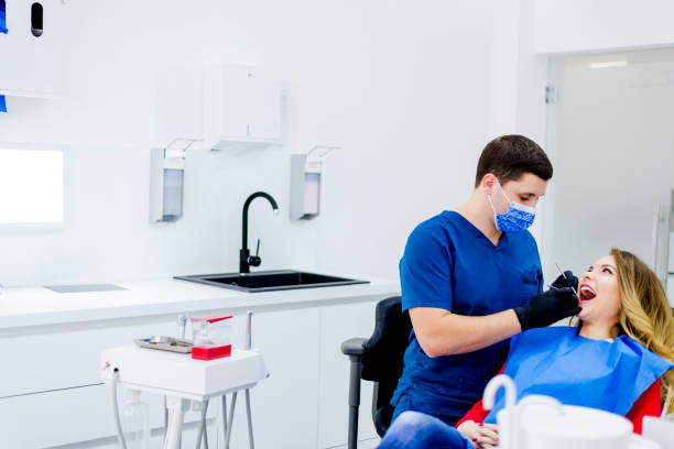 istock Dentist examining woman in clinic 1092376564