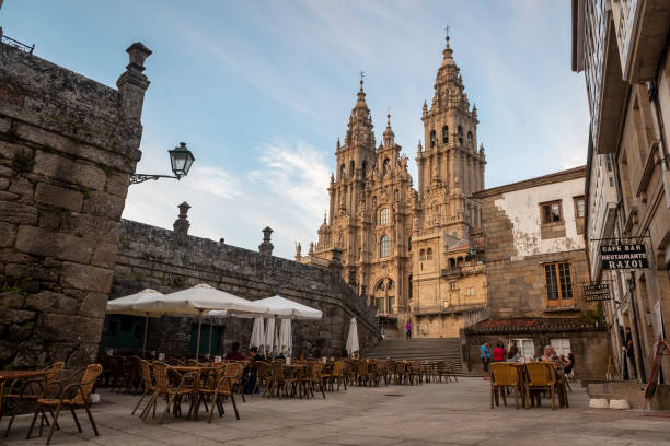 Santiago de Compostela Cathedral The Santiago de Compostela Cathedral rises above Obradoiro Square. The cathedral is the endpoint for people journeying on the Camino de Santiago. (July 12, 2018) camino de santiago photos stock pictures, royalty-free photos & images