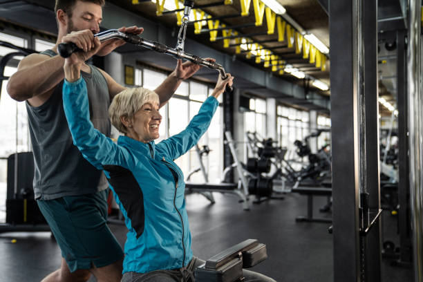 istock Personal trainer working exercise with senior woman in the gym 1092385576