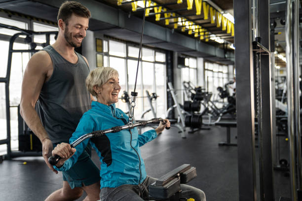 istock Personal trainer working exercise with senior woman in the gym 1092385598