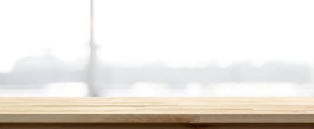 istock Wood table top on blur abstract white gray background, panoramic banner 1092392724