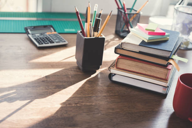 istock Stack of books and stationery on wood table 1092392762
