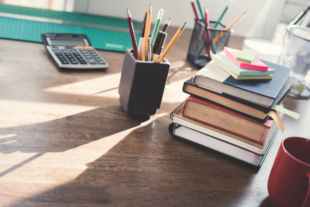 istock Stack of books and stationery on wood table 1092392770