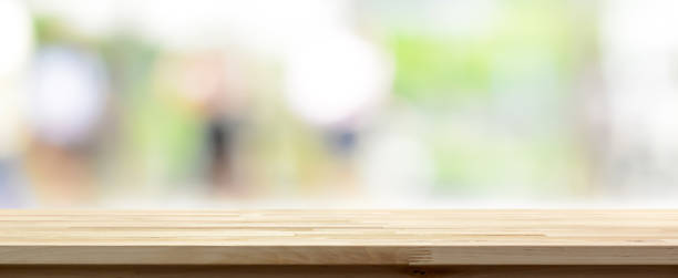 istock Wood table top on abstract bokeh white green background 1092392778