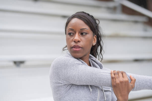 istock Female track athlete training at stadium 1092397126