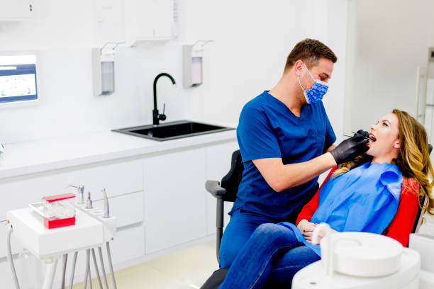 istock Dentist examining woman in clinic 1092397930