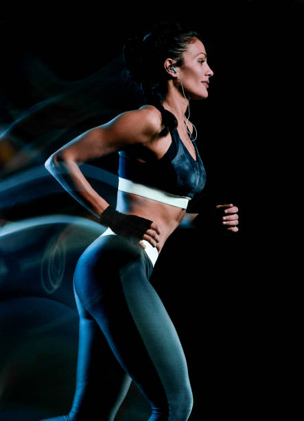 istock beautiful woman runner jogger jogging running isolated black bac 1092401230