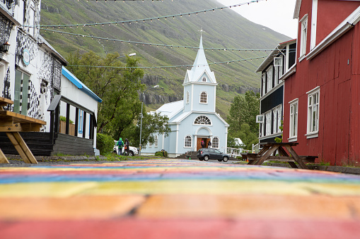 Church of Seydisfjordur, Iceland with rainbow pathway