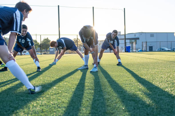 istock Soccer teammates stretching out before a match 1092406896