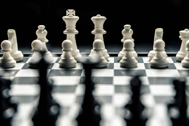 istock Chess board with black and white chess facing each other 1092409076