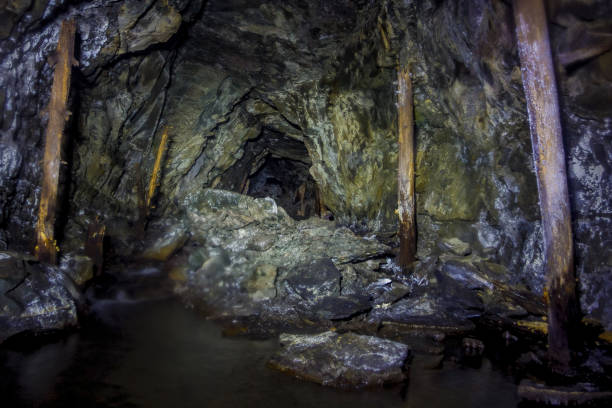 istock Collapsed and forgotten tunnel of an abandoned coal mine 1092410784