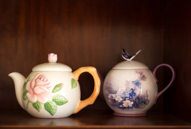 istock Two Vintage Tea Pots on Wooden Shelf 1092414358