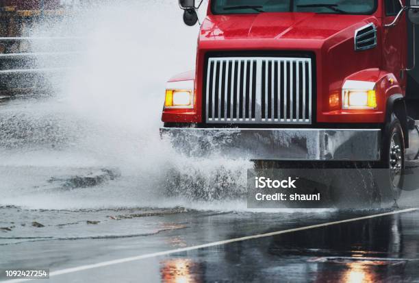 Dump Truck In Flooding Stock Photo - Download Image Now - Semi-Truck, Truck, Rain