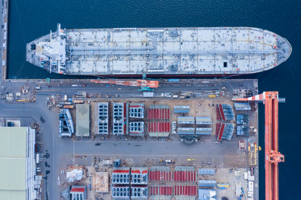 istock Factory with big ship and colorful container 1092427380