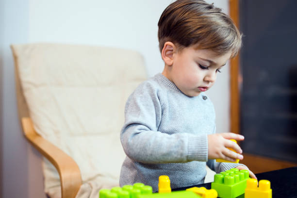 istock Little Boy Playing With Brick Block Toys at Home 1092437158