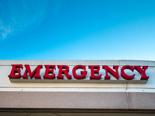 istock Looking Up at an Emergency Sign With clear skies 1092463586
