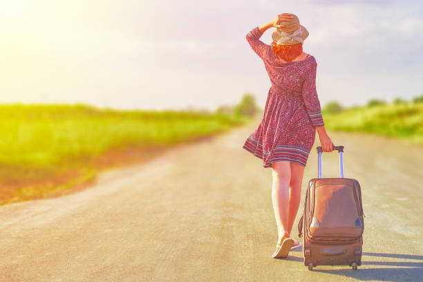 istock Beautiful woman hitchhiking 1092466634