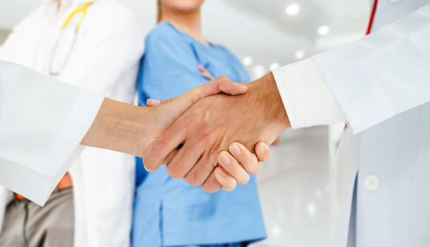 istock Doctor working in hospital with other doctors. 1092469570