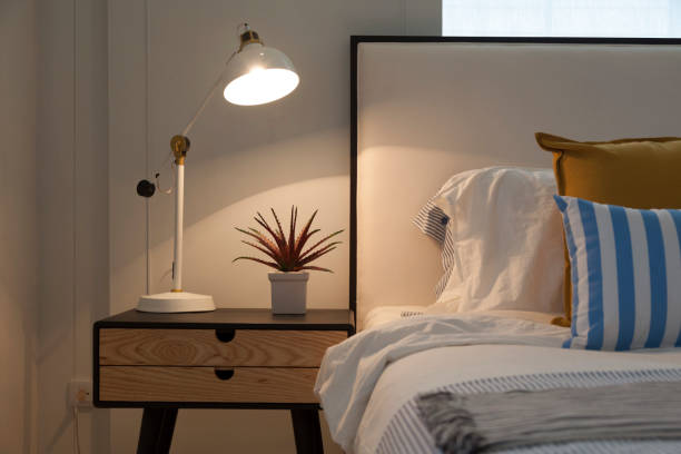 istock Modern home interior with bedroom setting including bedside table ,white lamp. 1092470272