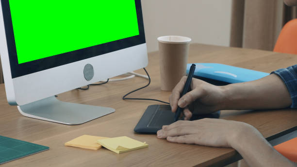 Business man having video conference call with green screen