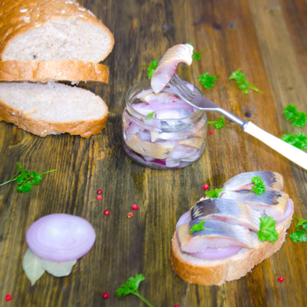 istock sandwich with herring and onions, fork on wooden background selective focus 1092476238