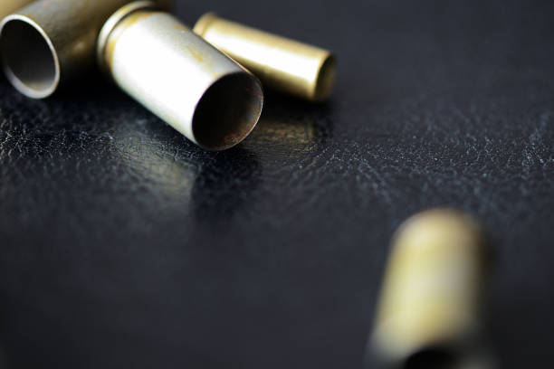 istock Empty old bullet cartridges on a dark background close up 1092479140